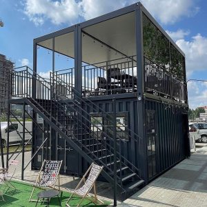 Portable coffee shop container setup with two floors.