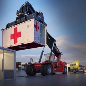 Crane lifting portable hospital container.